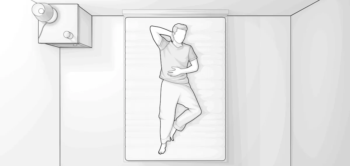 Ilustracja przedstawia sypialnię z lotu ptaka. Mężczyzna leży na plecach na materacu. obok po lewej stronie stolik nocny z lampką.