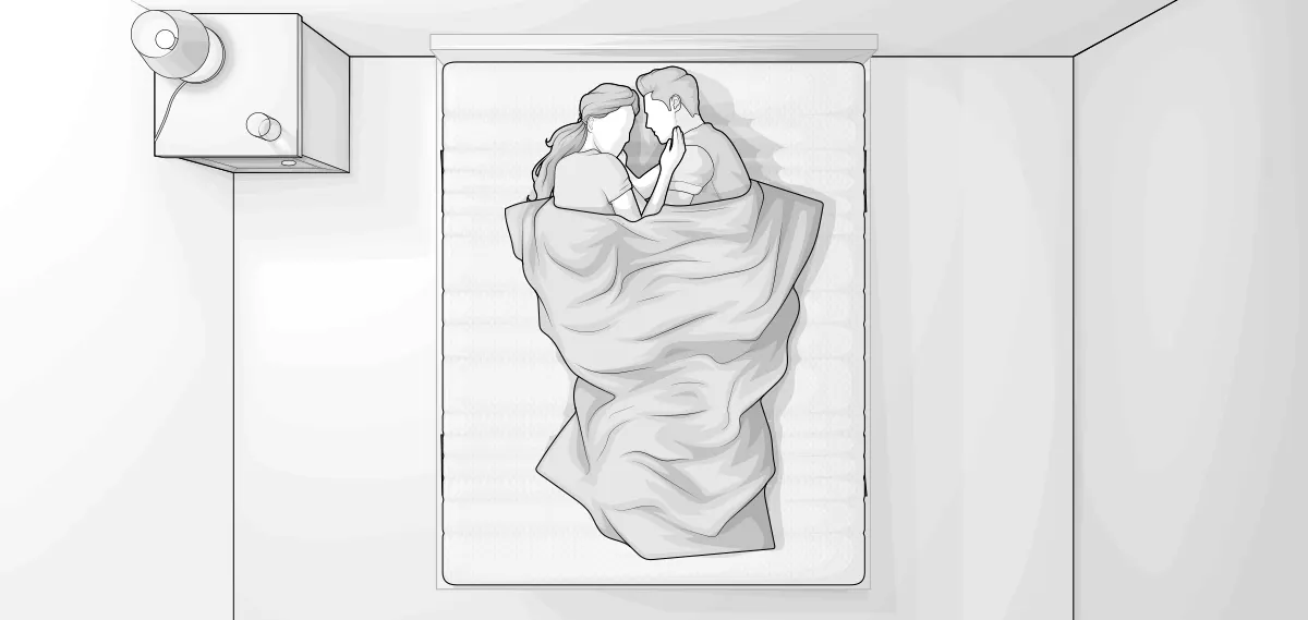 Ilustracja przedstawia sypialnię z góry. Na łóżku leży para przykryta kołdrą. W lewym górnym rogu stolik nocny z lampką.